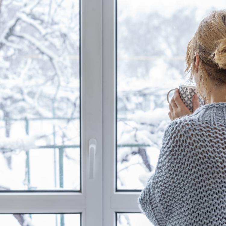 person looking out a window